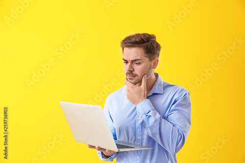 Thoughtful male programmer ...