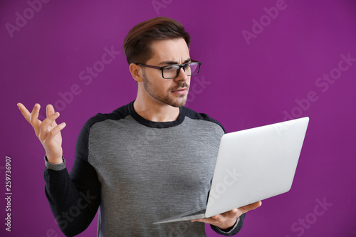 Male programmer with laptop...
