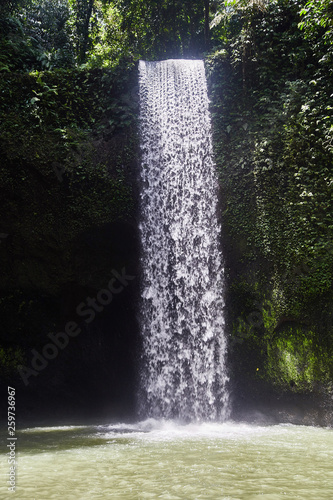 Air Terjun Tibumana. Blowing waterfall in Bali. 