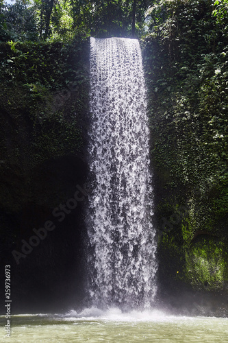 Air Terjun Tibumana. Blowing waterfall in Bali. 