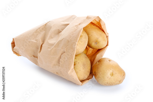 Bag with raw potato on white background