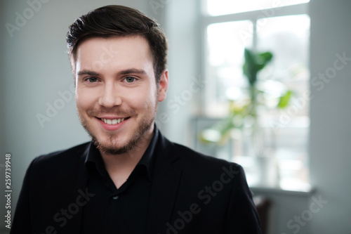 Confident young man attending job interview