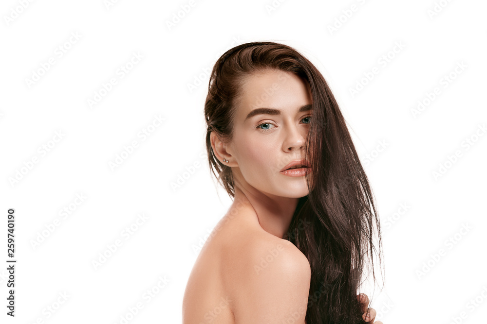 A beautiful female face. Perfect and clean skin of young caucasian woman on white studio background. A beautiful female face. Perfect and clean skin of young caucasian woman on white studio background.