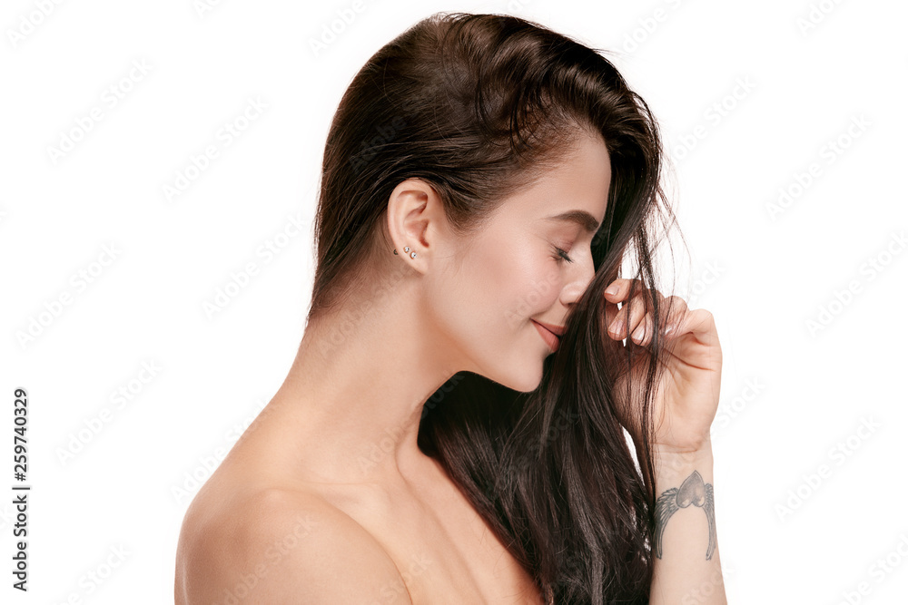 A beautiful female face. Perfect and clean skin of young caucasian woman on white studio background. A beautiful female face. Perfect and clean skin of young caucasian woman on white studio background.