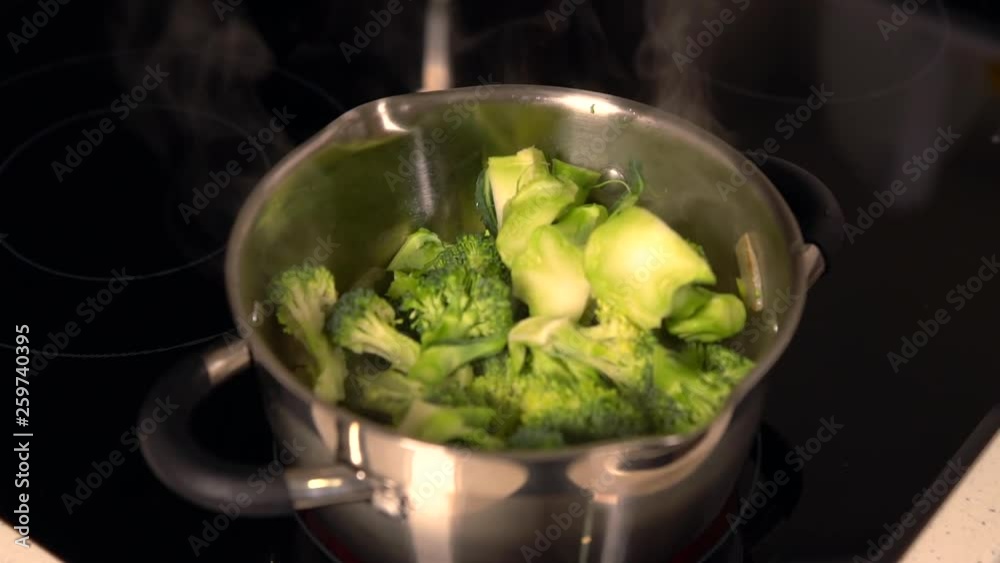 Steaming hot pot of fresh broccoli cooking Steaming hot pot of fresh broccoli cooking