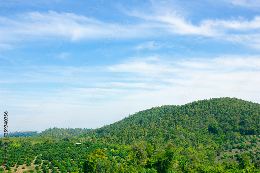 Landscape of sky and green mountain in summer season at north Thailand.
