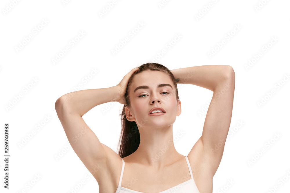 A beautiful female face. Perfect and clean skin of young caucasian woman on white studio background. A beautiful female face. Perfect and clean skin of young caucasian woman on white studio background.
