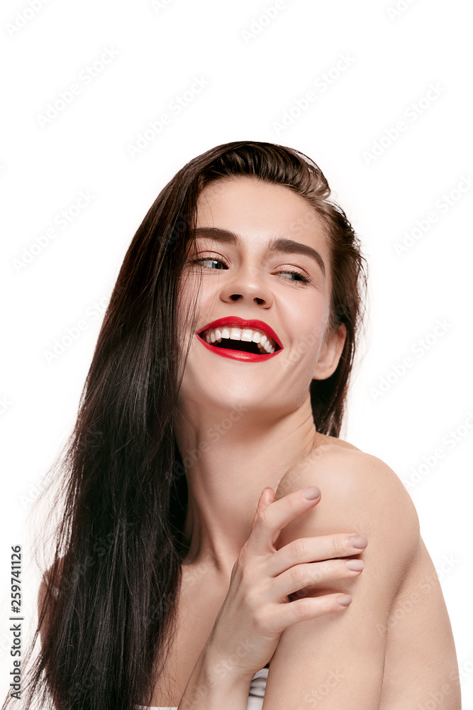 A beautiful female face. Perfect and clean skin of young caucasian woman on white studio background. A beautiful female face. Perfect and clean skin of young caucasian woman on white studio background.