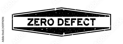 Grunge black zero defect word hexagon rubber seal stamp on white background
