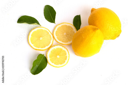 fresh lemons and green leave fruit flat lay food concept isolate on white background