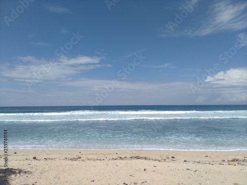 sunny sea and beach photos during the day. © saiful