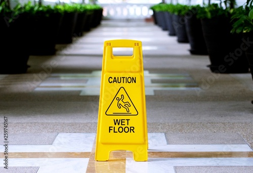 Sign showing warning of caution wet floor in the building