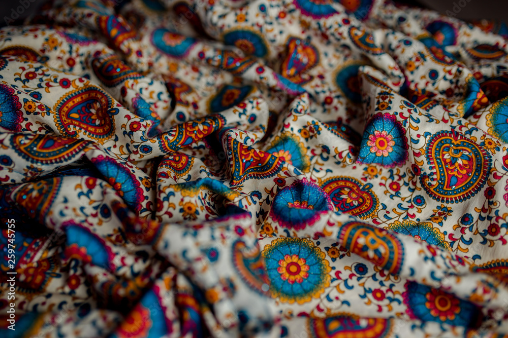 Indian colorful fabric with red, blue and green colors.