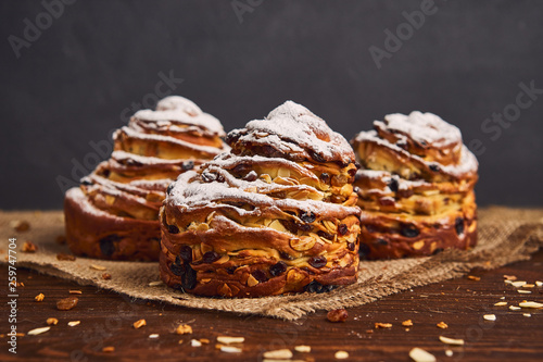 Tasty sweet buns with raisins and icing sugar. Homemade baking concept