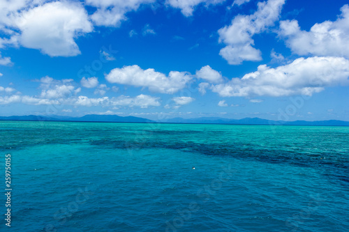 beautiful great barrier reef with white clouds on a sunny day  cairns  australia