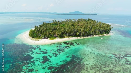 Aerial: flying over tropical island white beach caribbean sea turquoise water coral reef. Indonesia Sumatra Banyak islands. tourist destination diving snorkeling photo