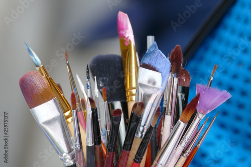 a set of brushes for drawing paints close-up
