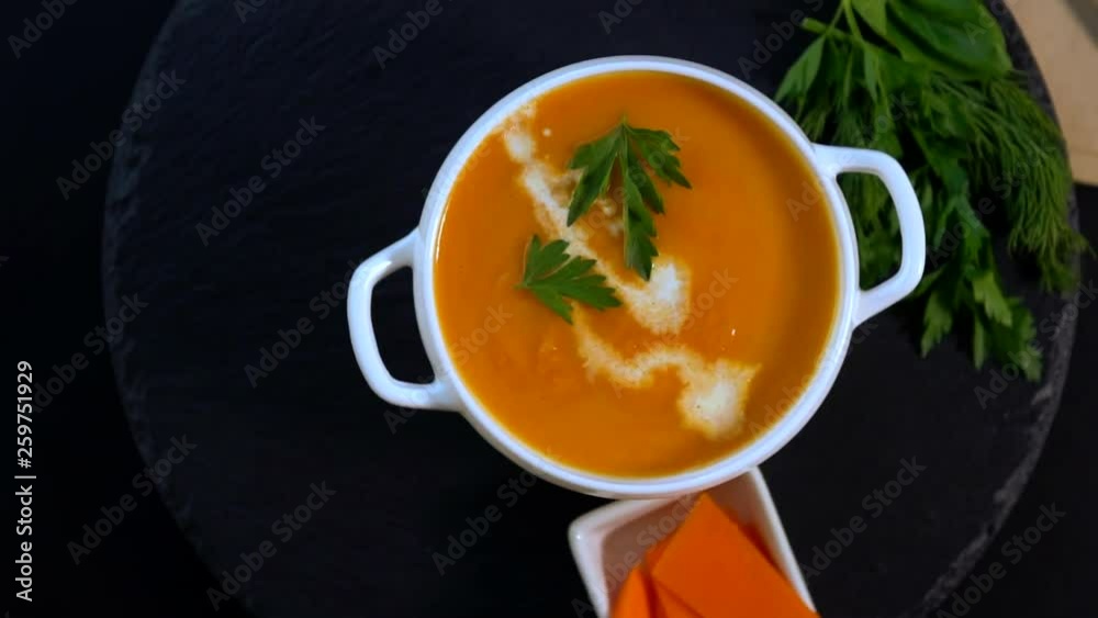 Serving of thick fresh homemade pumpkin soup