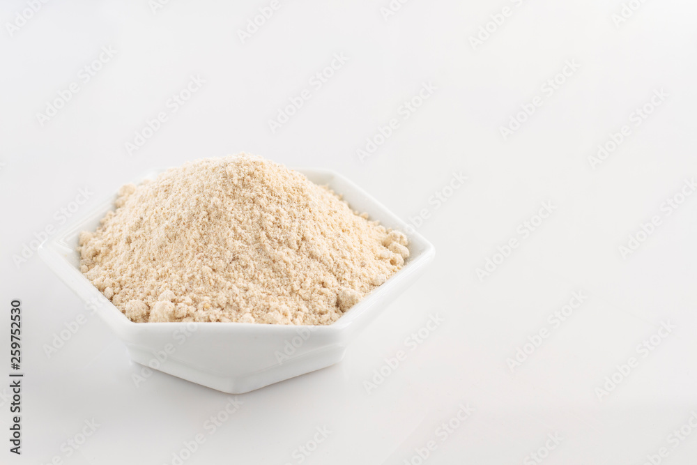 banana flour in bowl isolated on white background banana flour in bowl isolated on white background
