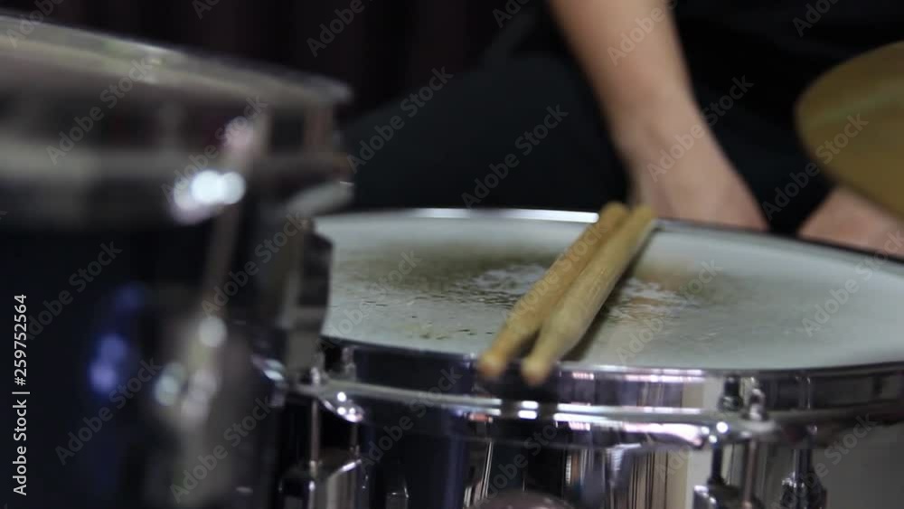 Drumsticks are placed on the snare drum. Close-up Drumsticks are placed on the snare drum. Close-up