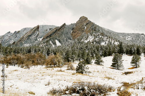 A Spring snow storm covers the mountain range, valley and Flatirons of Chautauqua Park, in Boulder, Colorado