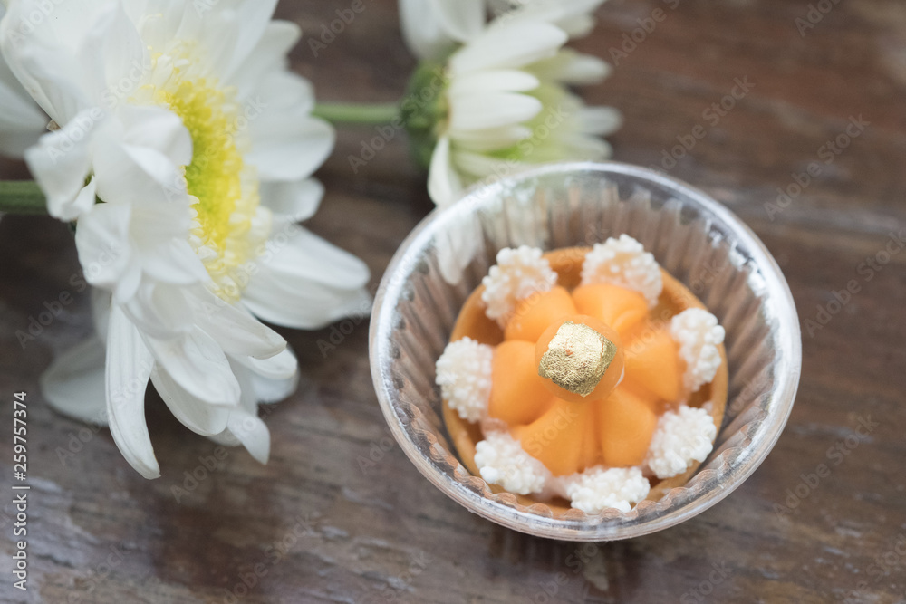 Kanom Jamongkut is Thai dessert on wood table Kanom Jamongkut is Thai dessert on wood table