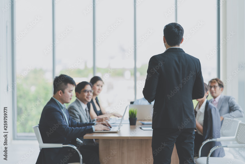 Businessman leader presenting to work while meeting wiht colleagues in office..Business Team Meeting Presentation,Conference Planning Business Concept Businessman leader presenting to work while meeting wiht colleagues in office..Business Team Meeting Presentation,Conference Planning Business Concept