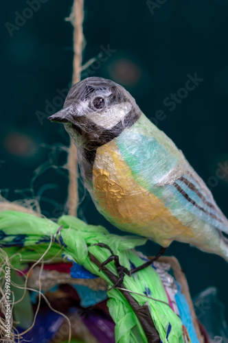 Recycled plastic waste Great Tit bird sculpture. Environment concept.