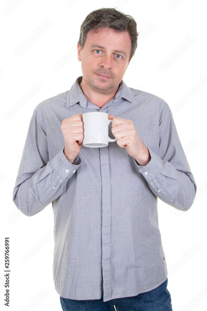 handsome man holding cup with coffee tea with serious face and blank white mug in hand handsome man holding cup with coffee tea with serious face and blank white mug in hand