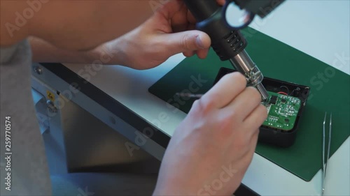 Hardware engineering. Technology science concept. Developer soldering air drone wires