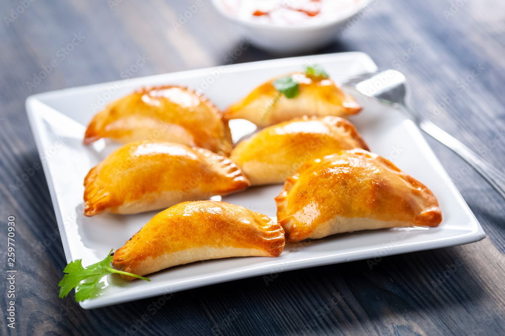 Empanada  -dumplings stuffed with meat and vegetable.