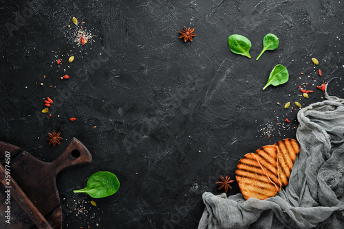 Serving the kitchen table. Black Food Background. Top view Free space for your text. Flat lay