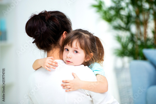 Mom hugs little daughter. Maternal love and family happiness. Happy children and parenthood