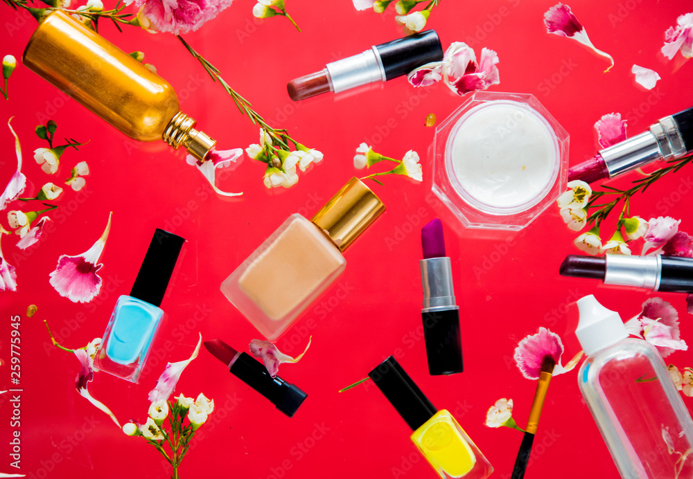 Perfume, nail polish and lipsticks with chamelaucium flowers