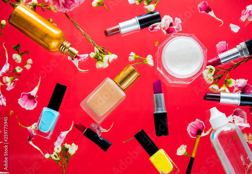 Perfume, nail polish and lipsticks with chamelaucium flowers