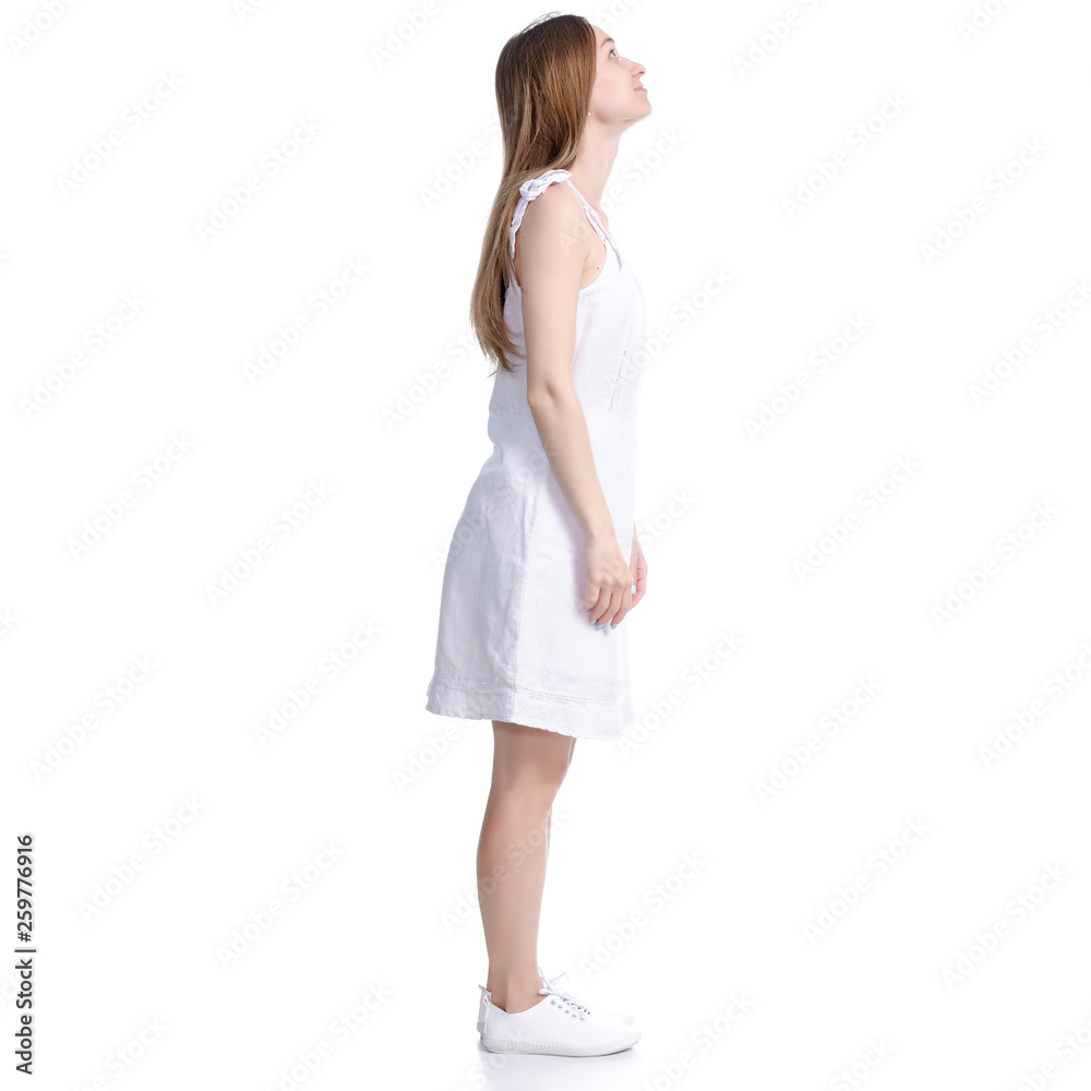 Woman in white dress standing looking up on white background isolation, back view Woman in white dress standing looking up on white background isolation, back view