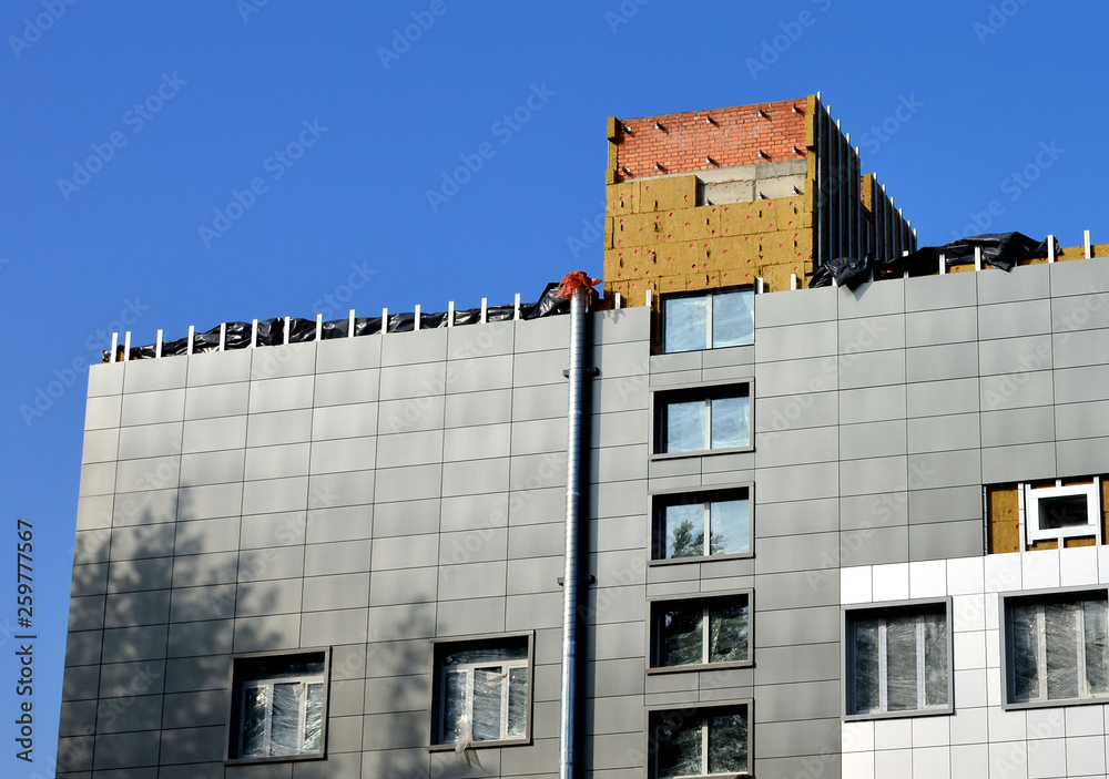 View of Facing of the building ventilated facade. Aluminum colored facades ...