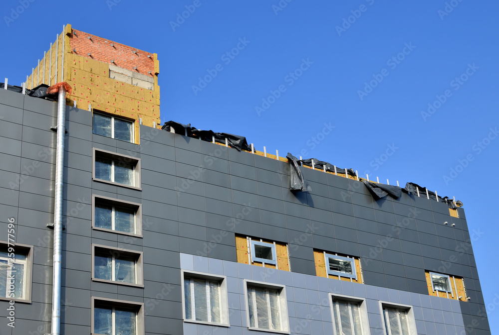 Facing of the building ventilated facade. Aluminum colored facades ...