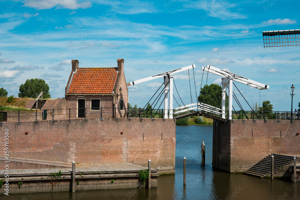 mill, lifting bridge and house in fortified city Heusden, The Netherlands
