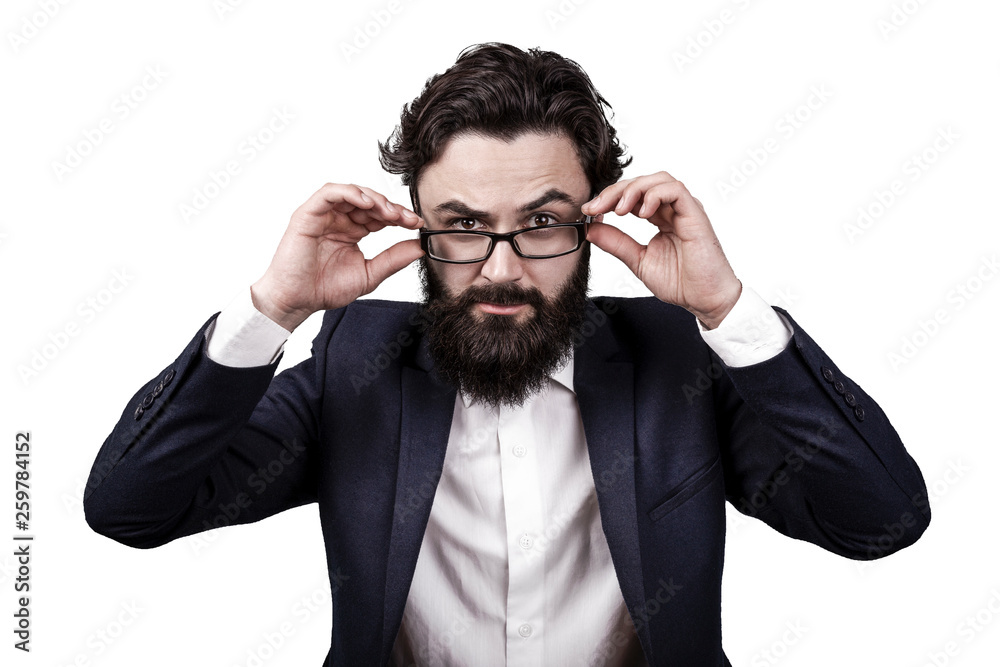 bearded business man isolated on white background, raised an eyebrow and seriously looks at the viewer bearded business man isolated on white background, raised an eyebrow and seriously looks at the viewer