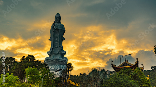 Ho quoc pagoda in phu Quoc island. Monument of Lady buddha in a beautiful sunset in Vietnam
