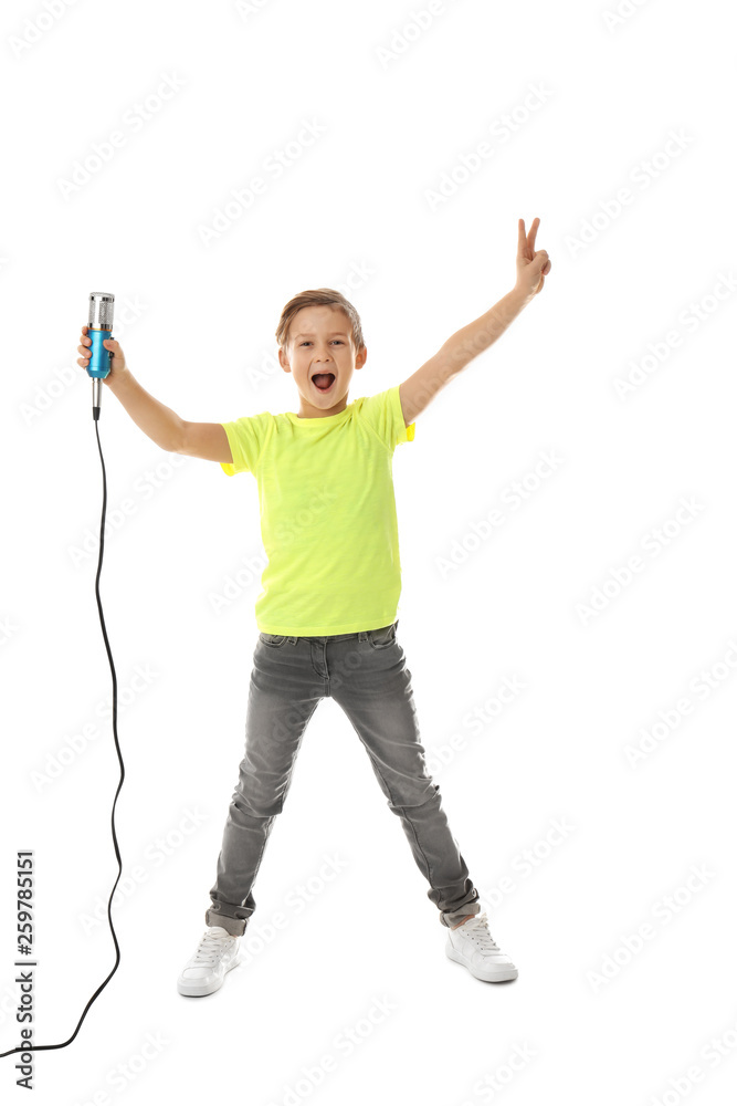 Cute boy with microphone on white background
