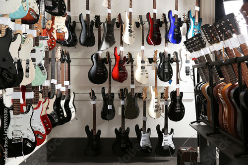 Rows of different guitars in music store