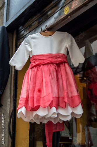 Girl dress hanging on the door of a store in the Rastro of Madrid. En Madrid. Spain.