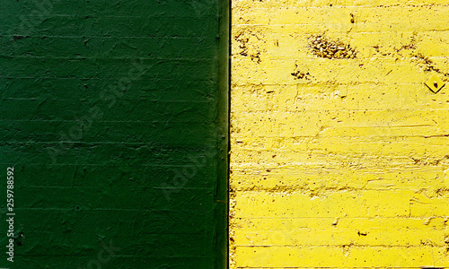 green and yellow textured concrete wall