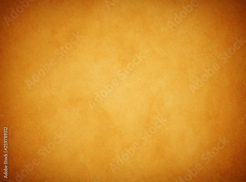 An elegant, rich tan parchment texture background with shadowed corners and glowing center. 