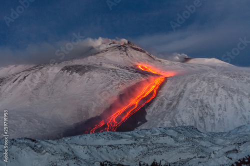 Etna volcano - lava flows and strombolian explosions from Southeast Crater - Snow landscape photo