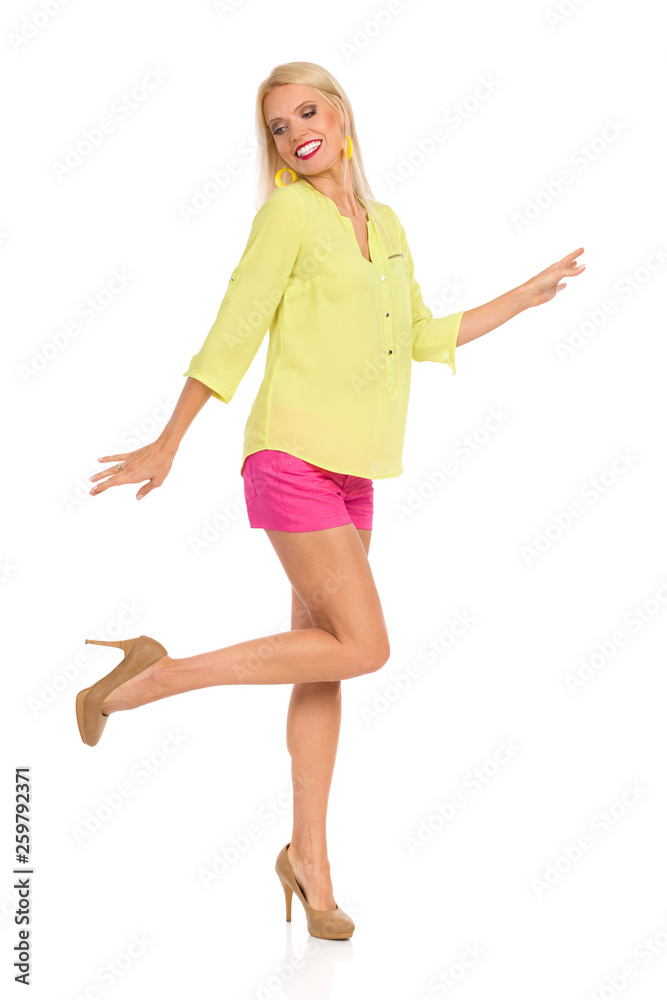 Dancing Woman In Vibrant Clothes And High Heels Dancing Woman In Vibrant Clothes And High Heels