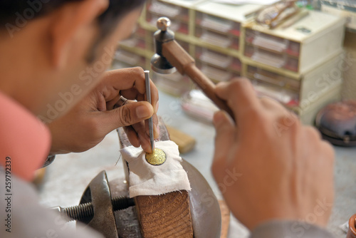 Craftsman working damascene photo