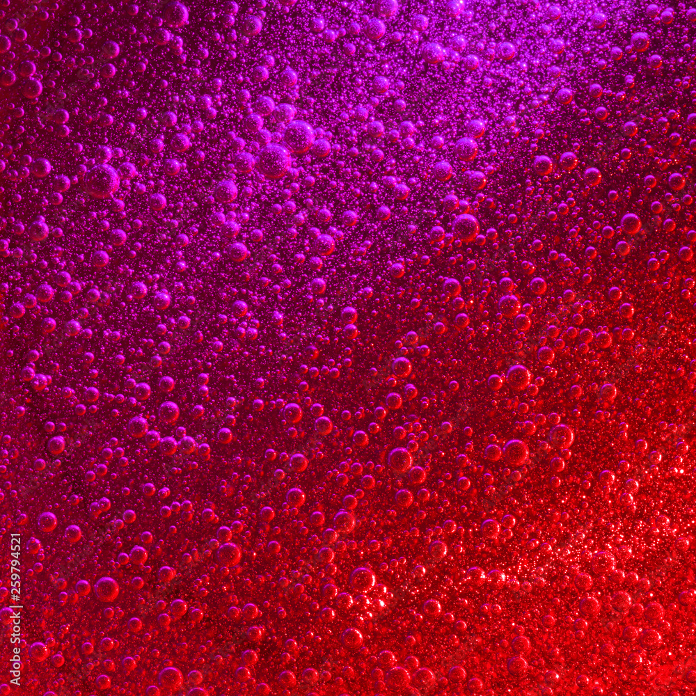 Red & purple liquid with impressive quantity of sparkling air bubbles.